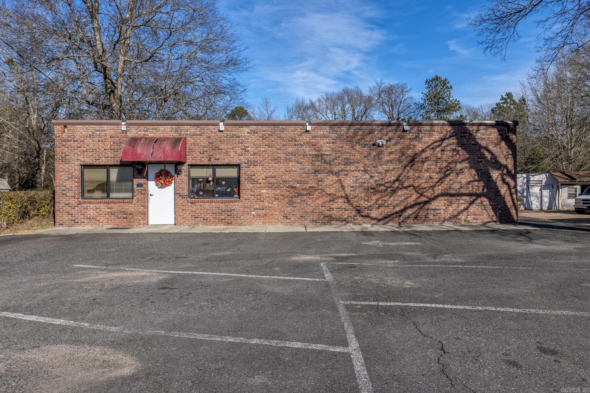 Prime opportunity in Arkadelphia, Arkansas on a major street. This property is currently set up as a daycare center but offers endless possibilities for a variety of commercial uses. The facility features two buildings, including a large gym space, multiple classrooms and office areas, kitchen space, and plenty of room to adapt to your business needs. Situated on an oversized lot, there is ample space for parking, outdoor activities, or future expansion. With its convenient location, versatile layout, and price to sell, this property is full of potential for an investor or business owner looking to establish or grow in the area.
