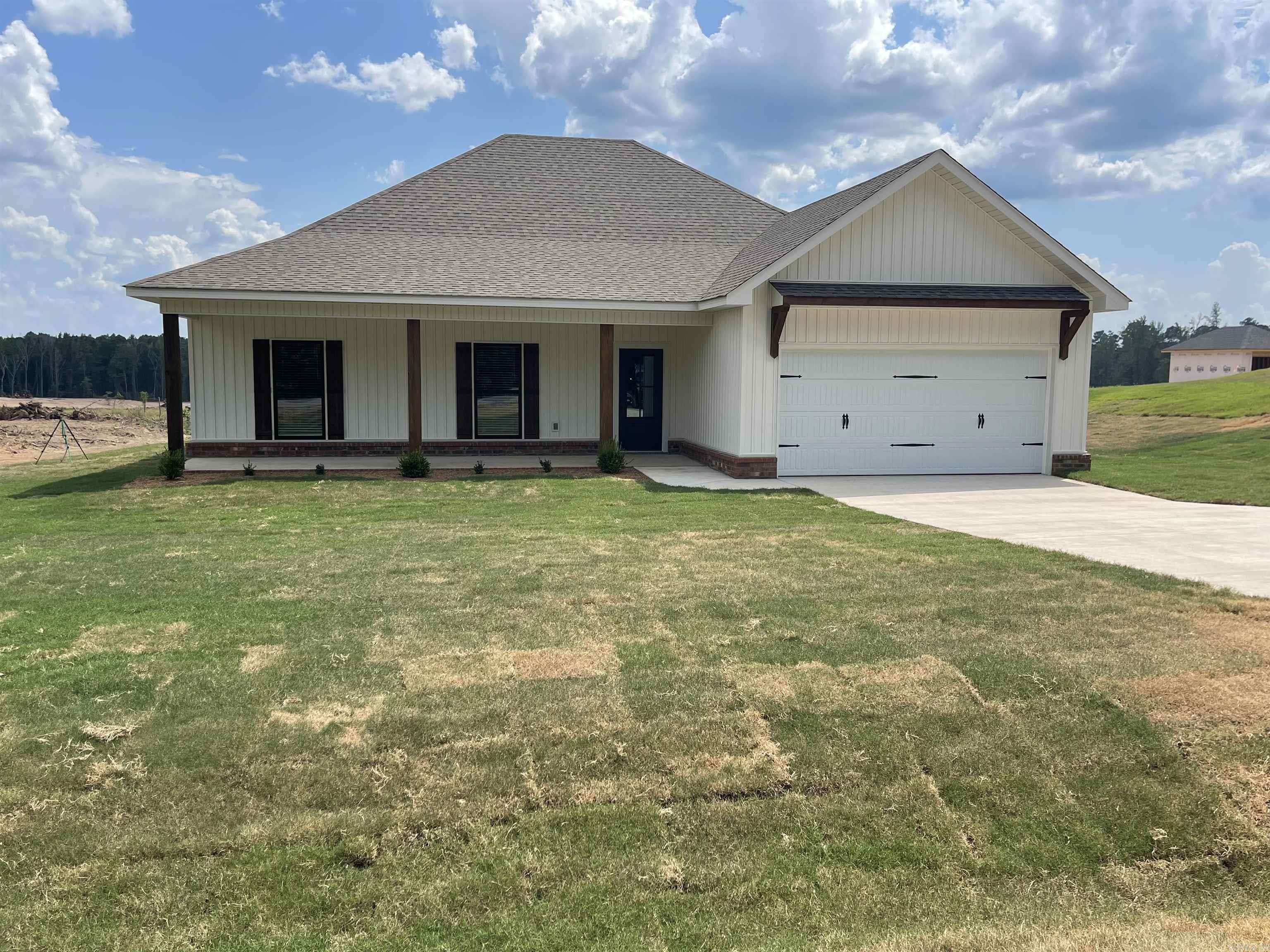 Great opportunity to own your dream home. Beautiful new construction with country atmosphere on one acre lot. Open floor plan with brick fireplace in living area. Primary bedroom features two large closets, double vanities and separate walkin shower. Covered back patio and 14 X 22 shop in backyard.