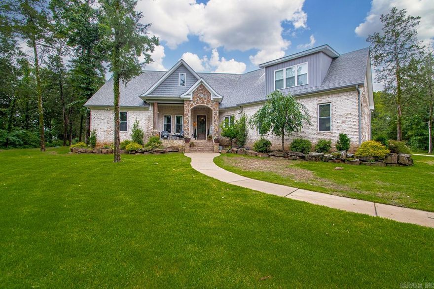 Welcome to 1125 Lisa Ln, Conway, AR – Your Private Retreat on 7 Acres  Tucked away within the city limits but offering the tranquility of the countryside, this stunning 3,547 sq. ft. home is a rare find in Conway. Set on 7 beautifully wooded acres, the property offers unmatched privacy and seclusion—completely hidden from view yet minutes from town conveniences.  This spacious home features 4 bedrooms, 3.5 bathrooms, a dedicated office, and a versatile bonus room perfect for a playroom, gym, or second living space. The open-concept design flows effortlessly, with natural light pouring in and peaceful views of the surrounding land.  Enjoy the convenience of a 2-car garage, and for the hobbyist or craftsman, a 30x30 shop provides ample space for projects, storage, or outdoor toys. Whether you're hosting friends or simply enjoying the quiet of your surroundings, this home delivers the best of country living without sacrificing access to city amenities.  Don’t miss your chance to own this secluded oasis in the heart of Conway!