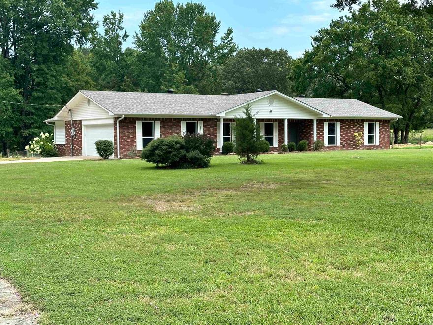 7.05 Acres! Looking for Country Setting with 4/3 & 2-Car Side Load Garage, RV Parking with Cover?  New roof, new septic tank, some new sewer lines & moved next to the driveway, new garage door & HVAC has been serviced.  House offers lots of new updates: removed all the popcorn ceiling, texture & fresh interior paint throughout the house & garage, some updated light fixtures & hardware fixtures, all new ceiling fans, new kitchen appliances, new kitchen cabinets, granite kitchen- countertop & tile backsplash, kitchen island, pantry closet, separate laundry room, new primary bedroom can use for In-Law Quarter with private bathroom & private entrance through back door, new mini-split HVAC unit, 3-barn doors, luxury vinyl in hall bath, hallway, living room, breakfast room, kitchen & primary suite bathroom. 3 bedrooms offers: original laminate flooring. All windows has been updated approximately 8 years ago & 2 x 6 walls. The Horses and chicken are allowed.  See Agents showing remarks!