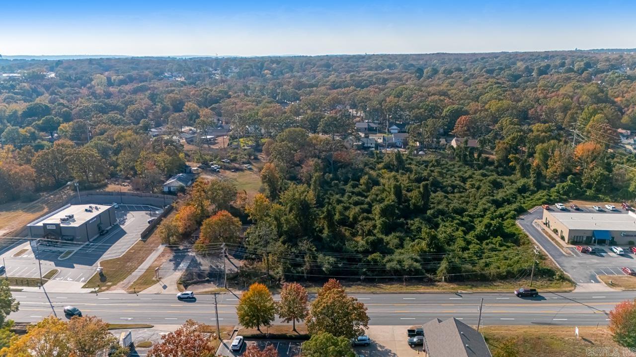 Nice land just off busy intersection with commercial potential. Adjacent to the Greens At North Hills golf course. Neighboring commercial properties include a medical office, insurance agency and a newly built liquor store.