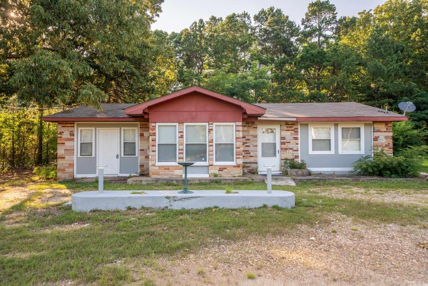 Great investment opportunity! This two bedroom - one bath home comes with almost 1/2 an acre of land and has highway road frontage.  It's located outside of the city limits and without restrictions. Agents, see remarks.