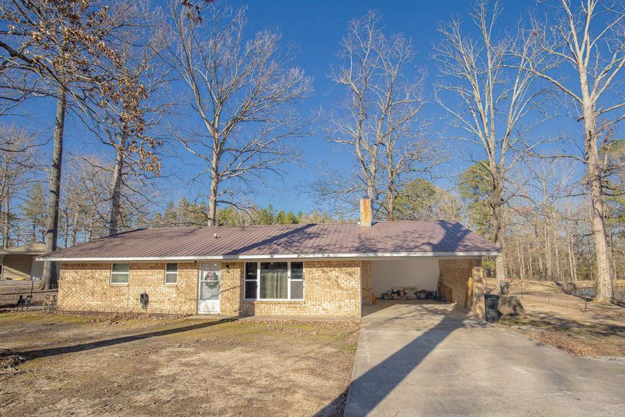 2 bedroom home with enclosed 30x40 shop with 30x20 gable carport! Home has new inside & outside HVAC. This charming 1373 square-foot nestled on 3.28-acres, fully fenced for privacy and security. The property also has a nice pond. Convenient location off hwy 35 N.  Close to Sheridan but convenient to Little Rock or Benton also.   Home is on a slab and has a wood-burning stove & metal roof.