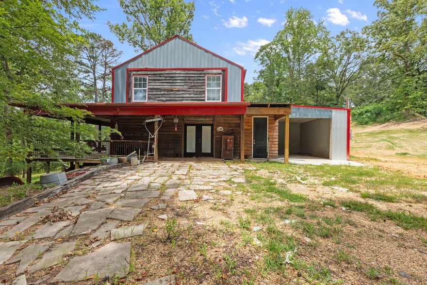 Welcome to your serene woodland retreat! Nestled on 4 acres of forest, this charming one-bedroom, 2.5 bathroom cabin offers a perfect blend of rustic charm and modern comfort. As you enter, you'll be captivated by the open floor plan that seamlessly combines the living room, kitchen, and dining area, creating an inviting space for relaxation and entertaining. The highlight of the main floor is undoubtedly the custom homemade staircase, crafted from trees harvested right from the property, adding a unique and natural touch to the home. Adjacent to the living area, you'll find a convenient bathroom and a spacious pantry, providing ample storage for all your needs. Ascend the beautiful staircase to discover the loft bedroom, a cozy and intimate space featuring a luxurious bathroom with a classic claw foot bathtub, second space upstairs can easily be turned into a 2nd bedroom. You can easily step outside onto the expansive wrap-around porch, where you can enjoy your morning coffee surrounded by peaceful sounds of nature. The property also offers the exciting potential for additional bedroom with another bathroom, right off of the garage. Dont miss this amazing property!