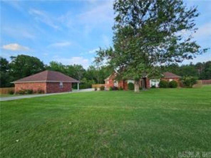 Step into this beautifully maintained home nestled in the desirable Cove Landing community. Offering 3 to 4 generously sized bedrooms, 2 full bathrooms, and a convenient half bath, this home provides both space and comfort for everyday living. The primary suite is a true retreat, featuring a spacious walk-in closet, a walk-in shower, and a luxurious whirlpool tub—perfect for unwinding after a long day. The expansive living and dining areas create an inviting space ideal for entertaining family and friends. Situated on over an acre of land, the property offers a serene and private setting. Enjoy outdoor living on the open deck, complete with a ramp for easy accessibility. For hobbyists or those in need of a versatile space, a 36 × 24 ft heated and cooled workshop awaits. On cooler days, cozy up indoors beside the warm glow of the gas log fireplace. This home truly blends comfort, functionality, and charm—inside and out. **Agents please see private remarks **