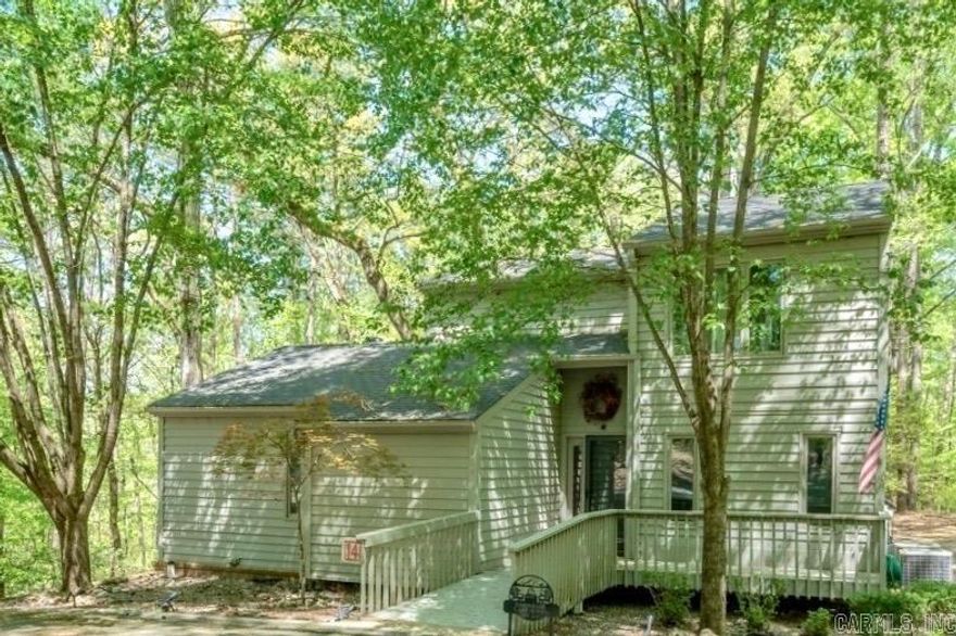 Enjoy access to Lake Ouachita from this fully furnished 1,867± sq ft, 4-bed/3.5-bath condo in the gated Silver Point Subdivision in Mount Ida. The condo borders U.S. Corps of Engineers land, so you can walk right down to the lake — no crowds, just you and the water.  Surrounded by woods, this free-standing condo offers a sense of privacy, seasonal lake views, and easy access to outdoor recreation. Whether boating, swimming, fishing, or simply relaxing, this location offers the ultimate lake lifestyle.  Features You'll Love: - Wood-burning fireplace w/ 2-story stone surround - Stone walk-in shower & heated floors - Granite countertops - Hand-scraped hardwood floors, slate tile, & wool carpet - Screen porch & large deck - Community pool, cabana, & onsite caretaker - All interior furniture & appliances convey - Option to rent garage/storage unit  POA dues cover water, trash, & exterior upkeep—ideal for a low-maintenance getaway.  1.2 mile away, the Twin Creek Recreation Area has a public boat launch, swim beach, campground, and fishing pier. The Lake Ouachita Vista Trail (LOViT) is also nearby — a favorite for hikers and mountain bikers. 15 min to Mount Ida. 30 min to Hot Springs.