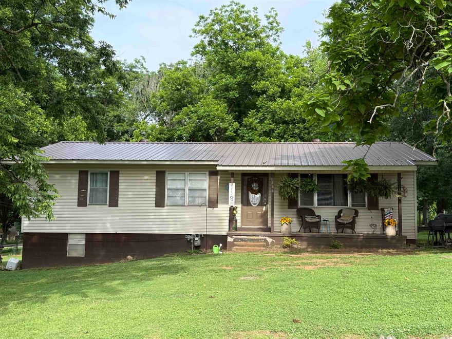 Nice home in town on 8 lots! 3 Bedrooms, big living area, open kitchen and dining area, a mixture of hardwood and vinyl flooring throughout, large pantry area right off of the kitchen, and a door that leads to the outside off of the utility room. The 8 lots have just enough trees to give you shade on those hot days, and gives you plenty of space for garden areas, flower beds, swingsets for the kids, or just build a big shop!  The home has an unfinished walk-out basement with plenty of room for storage as well.  The porch is the perfect place to sit and drink your coffee in the morning. The location is not very far from Spring River public access if you like to be on the water!