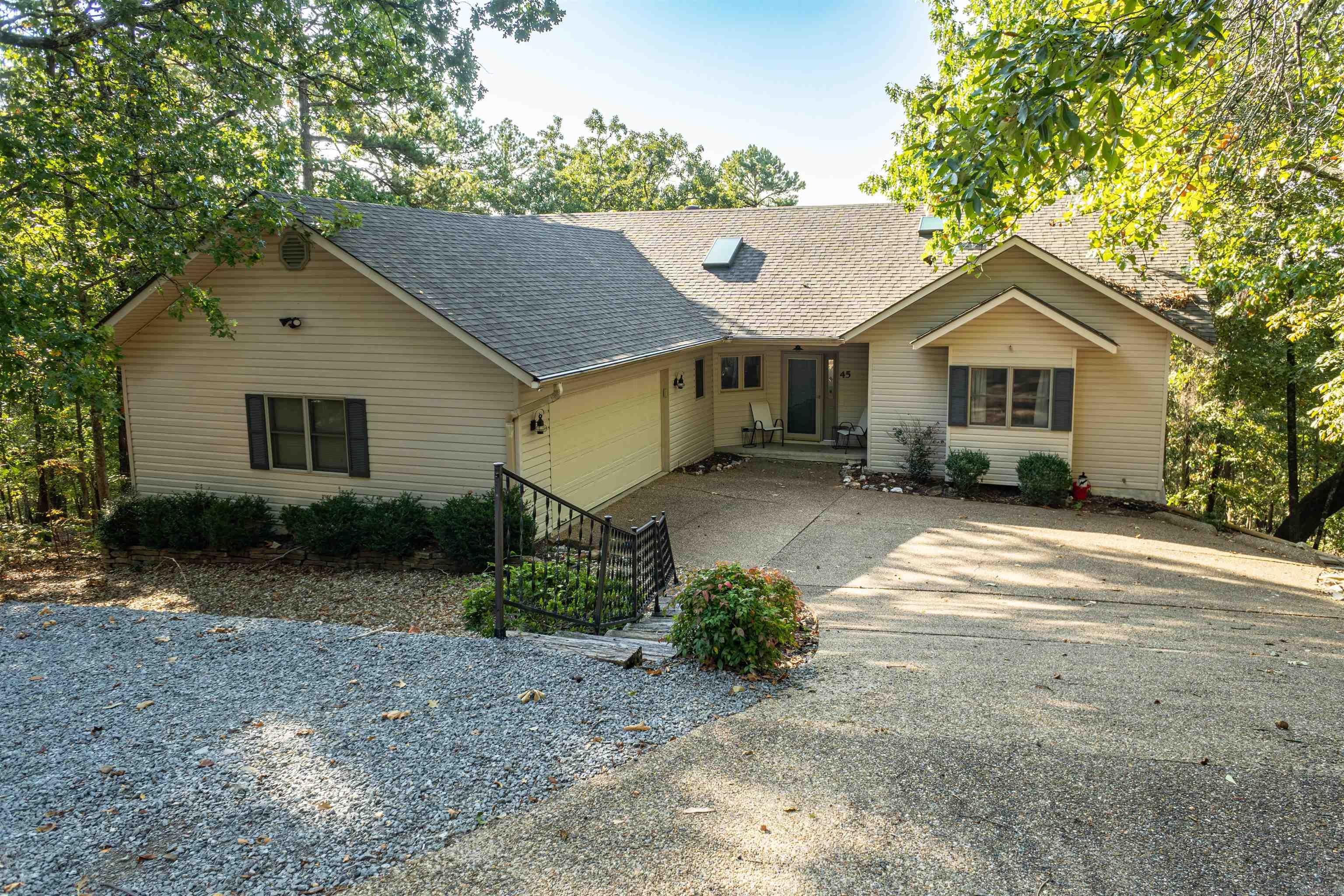 What a find! Home has been completely remodeled. New flooring, paint, light fixtures, bathroom fixtures, granite countertop. And then there is the view! This very comfortable 3 bed/2 bath home has great natural light sitting on .4 acres looking out over the woods and a vista in the distance. The Arkansas room offers serene sitting and a deck for outdoor cooking. Home is conveniently located near all the amenities outside the West Gate. Contents negotiable. New residents subject to $2,000 HSV POA buy-in fee. Please provide Proof of funds for cash offer and Pre-approval letter for mortgage.