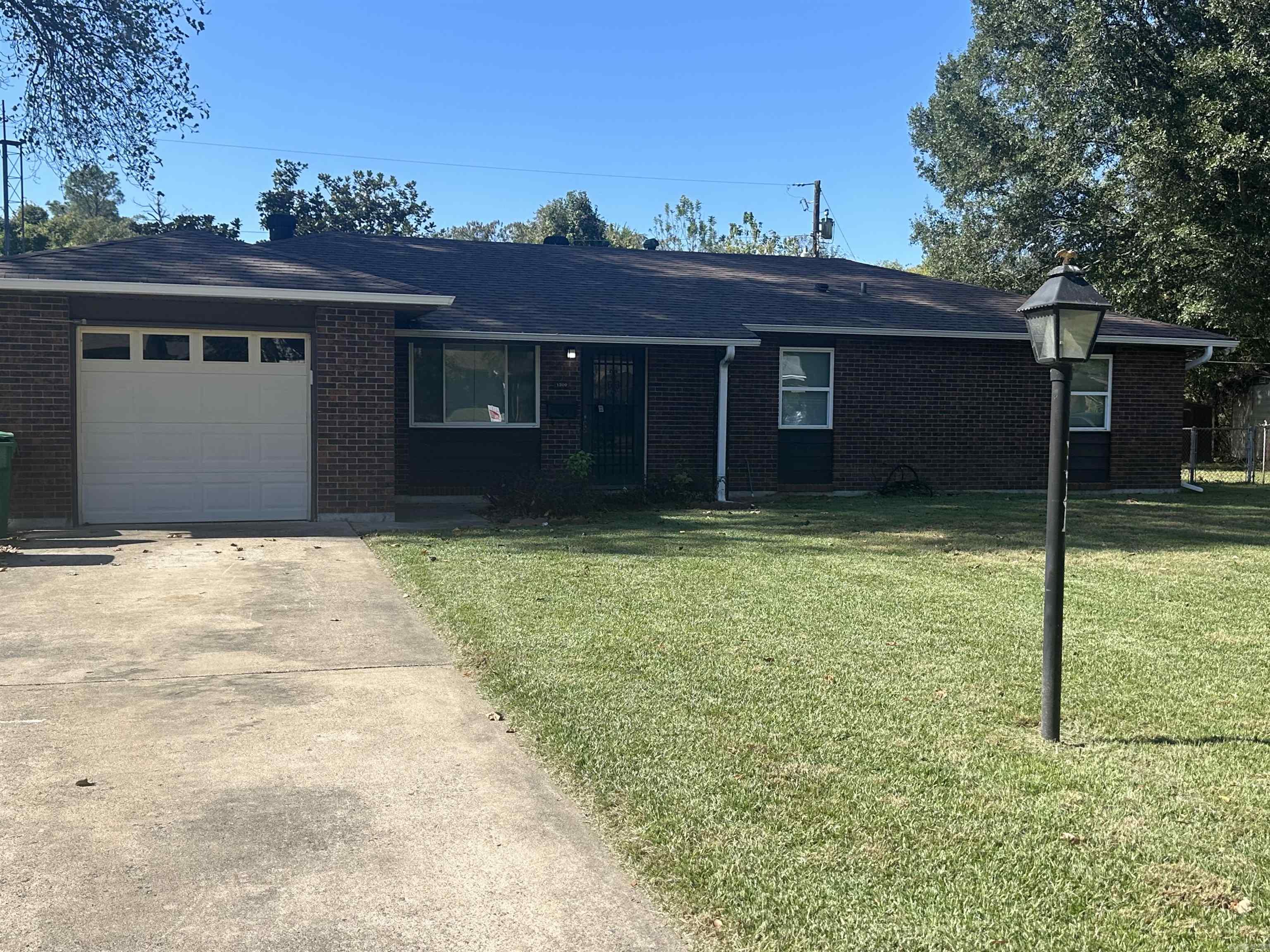 Welcome to this well-kept 3 bedroom, 1.5 bath brick home, perfectly situated on a spacious and beautifully maintained lot. This property offers plenty of charm, and a fenced-in backyard with a covered patio-perfect for entertaining. This home also features an attached garage. This home is SOLD AS-IS but is full of possibilities! Schedule your showing today!