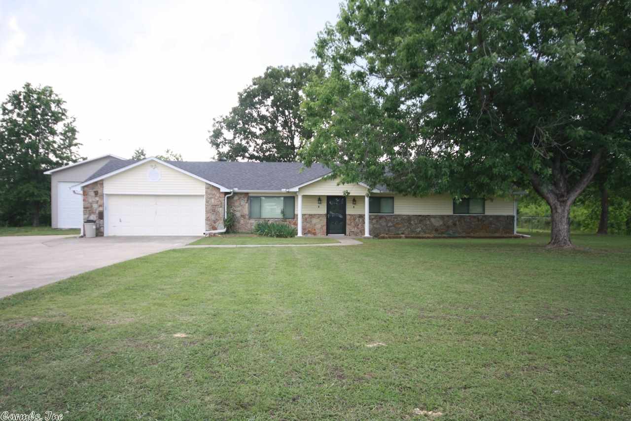 Completely updated home on 1/2 ac with 28x38 shop that will accommodate an RV. Home has new roof, new HW floors & tile, remodeled kitchen w cabinets & upgraded Kenmore Elite appliances, granite counters w/ travertine backsplash. See online Amenity sheet and agent remarks!