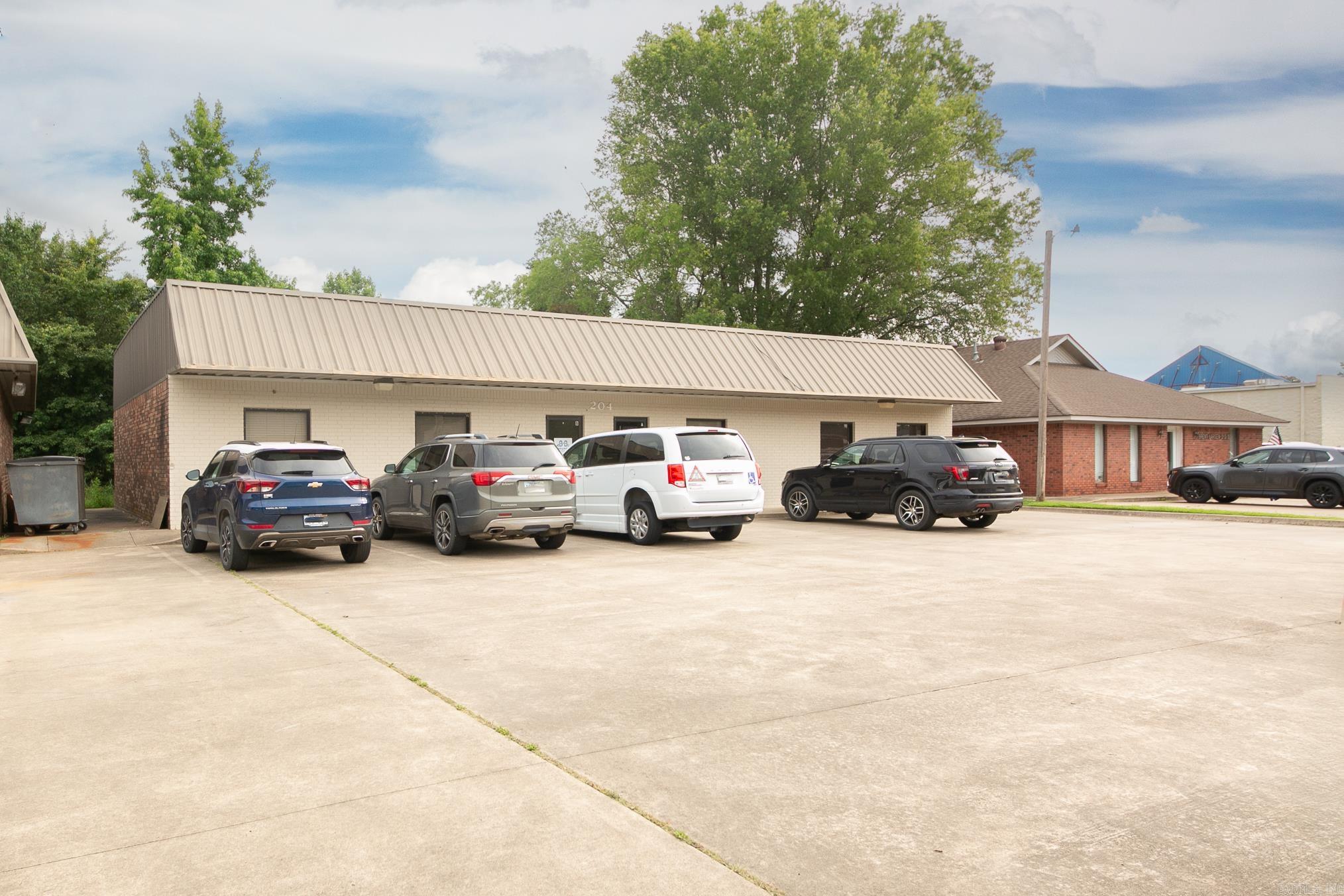 Located in the heart of Cabot, AR, 204 Plaza Blvd is a prime commercial investment opportunity priced at $325,000. It offers ample space, functionality, and 64 shared parking spots for convenience. With accessible trash cans and a metal roof scheduled for a protective coating in May 2025, backed by a 10-year warranty, its durability is assured. Nearby, 206 Plaza Blvd, available for $615,000, features a spacious layout and a loading door for easy inventory management. Both properties share the benefits of ample parking and future roof enhancements. For a larger footprint, 109 Plaza Blvd is listed at $660,000, offering the same conveniences in a strategic location. Investors can purchase 204 and 206 Plaza Blvd together for $900,000 or all three properties for $1,500,000, providing flexible investment options.