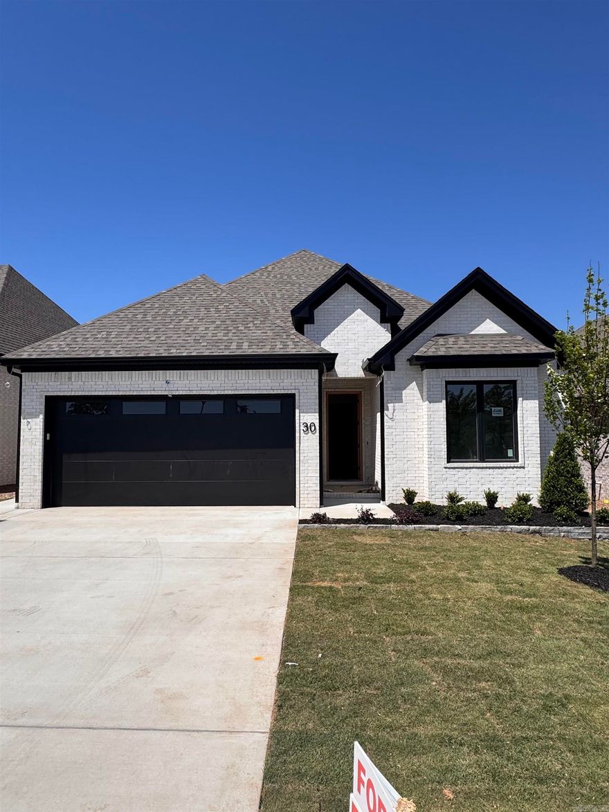 Discover Mountain Brook, West Little Rock’s newest neighborhood, ideally situated off Highway 10 behind The Ranch. This single-level Ranch home blends quality craftsmanship with modern style, offering four bedrooms and three bathrooms. The primary suite is a true retreat, featuring a spa-inspired bath with a soaking tub, walk-in shower, and a custom-designed closet. The living room impresses with soaring 12-foot ceilings and a stunning floor-to-ceiling tiled fireplace. At the center of the home, the chef’s kitchen showcases quartz countertops, custom cabinetry, dining area with coffee bar, and a corner pantry—perfect for both everyday living and entertaining. Step outside to enjoy relaxing evenings by the outdoor fireplace. Scheduled for completion in May 2026. Contact the listing agent today to schedule your private tour..