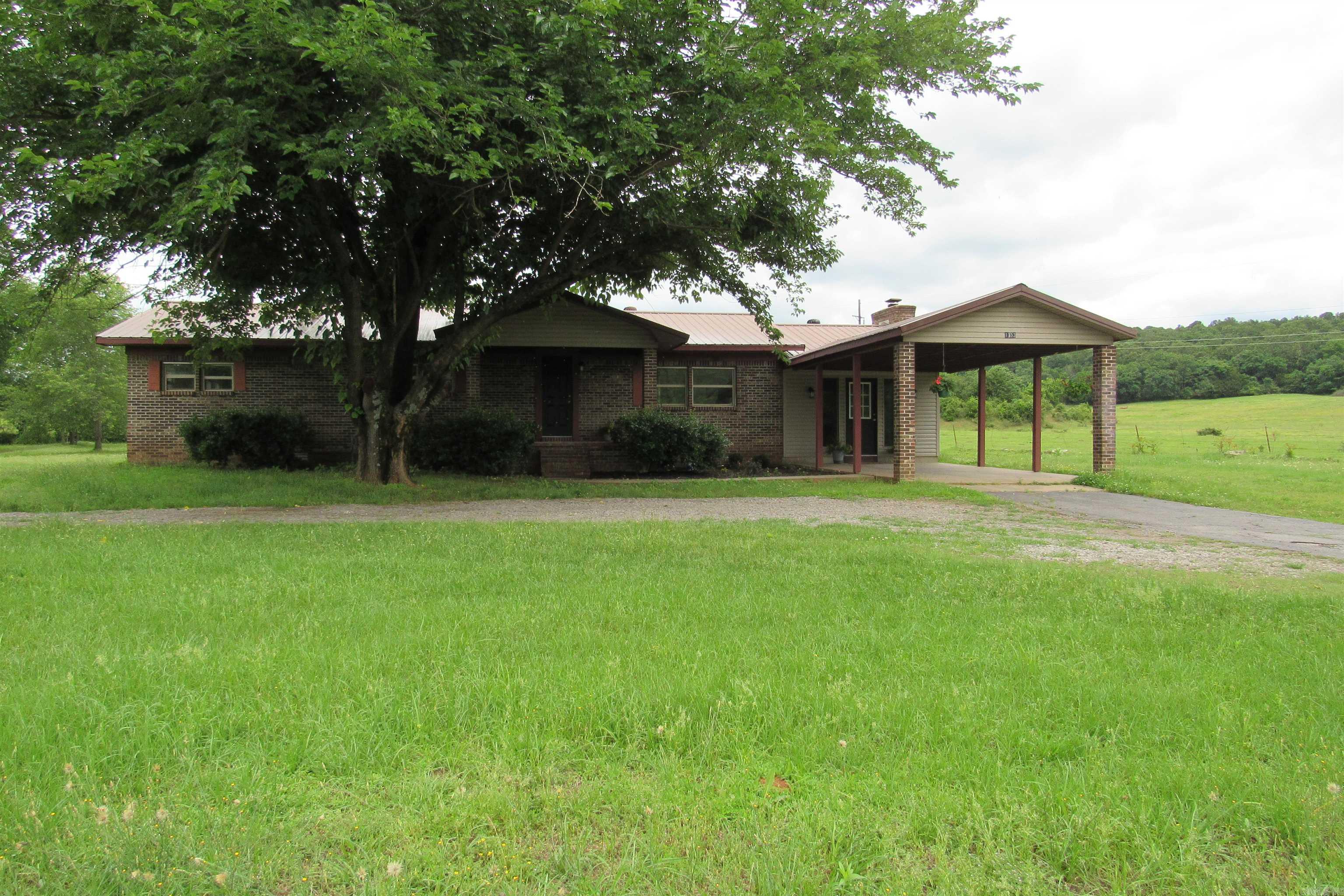 Newly remodeled. All new: trim, floors, light fixtures, hardware, baths, new custom cabinets with butcher block tops, stainless steel appliances. All new drywall and paint. New doors. Approx 1 ac and next to a big field. Cozy up to the fireplace in the winter and enjoy the city living with solitude. Near the high school, shopping, and the hospital. If you like kayaking or canoeing, the Mulberry River is less than 12 miles up Highway 23, where there is ample opportunity to hike or go off-roading. And if you like fishing or launching a boat for an evening boat ride, the Arkansas River is just up the street.