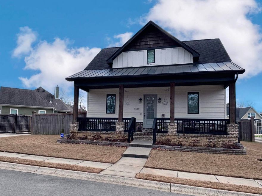 Beautifully designed 4BR/3BA two-story home in Bryant near Mills Park, offering standout curb appeal and a gated driveway leading to a rear-entry garage, great for extra parking and convenience. Inside, enjoy an open layout highlighted by double brick archways and warm architectural character throughout. The stylish and functional kitchen features ceiling-height cabinetry and marble countertops, opening to dining area and spacious living area with fireplace. The floor plan is ideal with master bedroom suite on main level plus guest bedroom downstairs with its own full bath. Upstairs features two spacious bedrooms with walk-in closets and a full bath. Additional highlights include tankless water heater, walk-in floored attic space, nice cozy backyard, and very large relaxing front porch. Seller providing a 1-year home warranty!