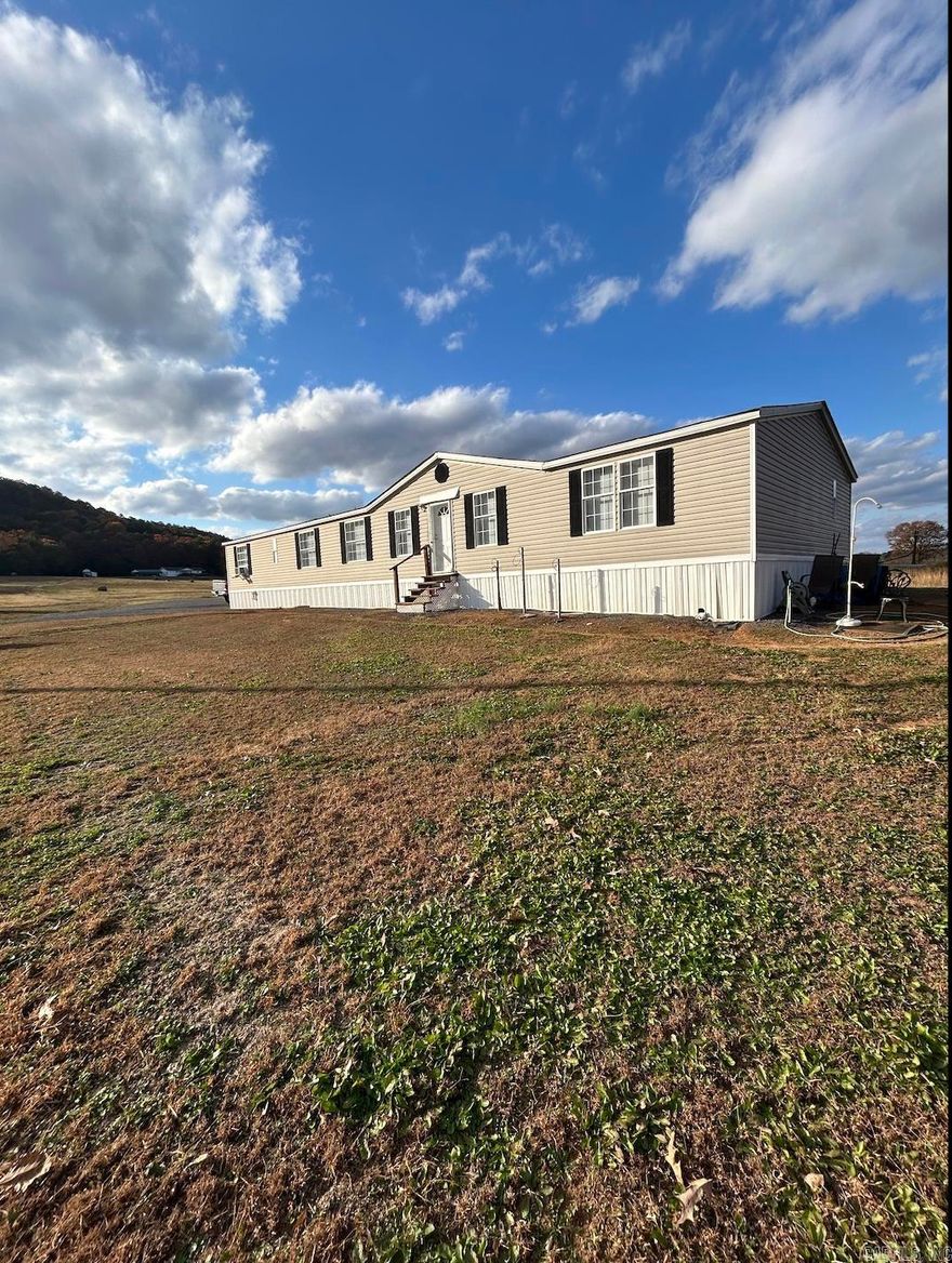 NEWER SPACIOUS DOUBLEWIDE MOBILE HOME ON 2 ACRES. NEW EXTRA LARGE SEPTIC SYSTEM TO ACCOMMODATE RV'S, ETC ON EAST SIDE OF HOUSE. FLAT LOT JUST OUTSIDE DOVER CITY LIMITS AND JUST 500 FT AWAY FROM SCENIC HWY #7 4-LANE THAT CONNECTS DOVER TO RUSSELLVILLE. GREAT PRIVATE LOCATION IN THE DOVER SCHOOL DISTRICT. CURRENTLY TENANT-OCCUPIED