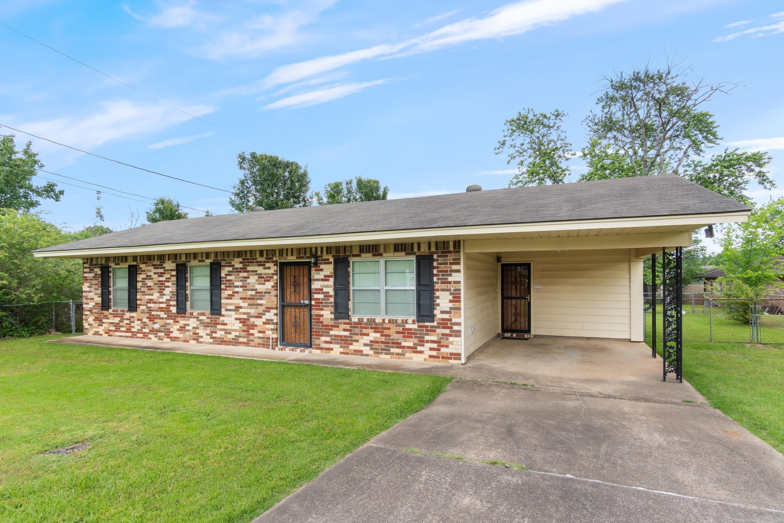 Well-maintained 3BR/1BA brick home in a quiet Morrilton neighborhood. Interior features a spacious living area, galley-style kitchen with stainless steel appliances. Refrigerator conveys. Situated on a level lot with a large, fenced backyard and storage shed that conveys. Covered carport and a clean, low-maintenance exterior make for easy living. This long-held family home has been well cared for and is move0in ready. Convenient location just minutes from downtown Morrilton with quick access to I-40. Ideal for first-time buyers, downsizers, or investors looking for solid value in a well-established area.