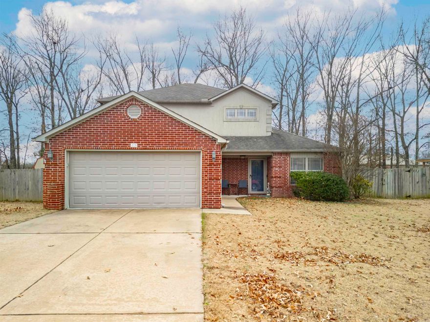 This three bedroom, two and one half bath home sits on a large privacy fenced lot. The large master bedroom and en suite bath are downstairs. Upstairs two bedrooms, full bath and large bonus room. Huge closets throughout home. 4th bedroom is a flex space that can be used as an office. Eat-in kitchen with quarry tile. Separate laundry room. Covered gutters. Partially floored attic. All kitchen appliances stainless steel. Interiors have been refinished with new carpet and new paint. This house has a lot of space for everyone.