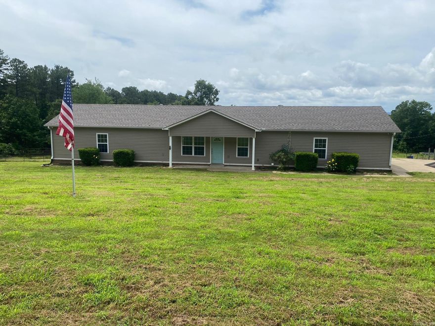 Enjoy the peace and privacy of country living on 1.5 acres just outside the Vilonia city limits. This beautifully designed 1,524 sq. ft. home offers 3 spacious bedrooms and 3.5 baths, with each bedroom featuring its own private ensuite bath for exceptional comfort and convenience.  Inside, you’ll find an inviting open-concept layout with a split-bedroom floor plan, ideal for both everyday living and entertaining. The kitchen showcases stylish concrete countertops and flows seamlessly into the main living spaces. A built-in safe room located in one of the primary bedroom closets provides added peace of mind.  Step outside and enjoy the large deck overlooking the property — perfect for relaxing evenings, grilling, or hosting family and friends. The partially fenced acreage offers room to roam, with space for a horse or other outdoor hobbies.  Need extra storage or workspace? The 18x30 shop with electricity is ready for projects, equipment, or recreational use. Major updates include a BRAND NEW ROOF installed in January 2026 and septic system pumped in March 2026.  If you’ve been looking for quiet country charm with modern functionality, this property is one you won’t want to miss!