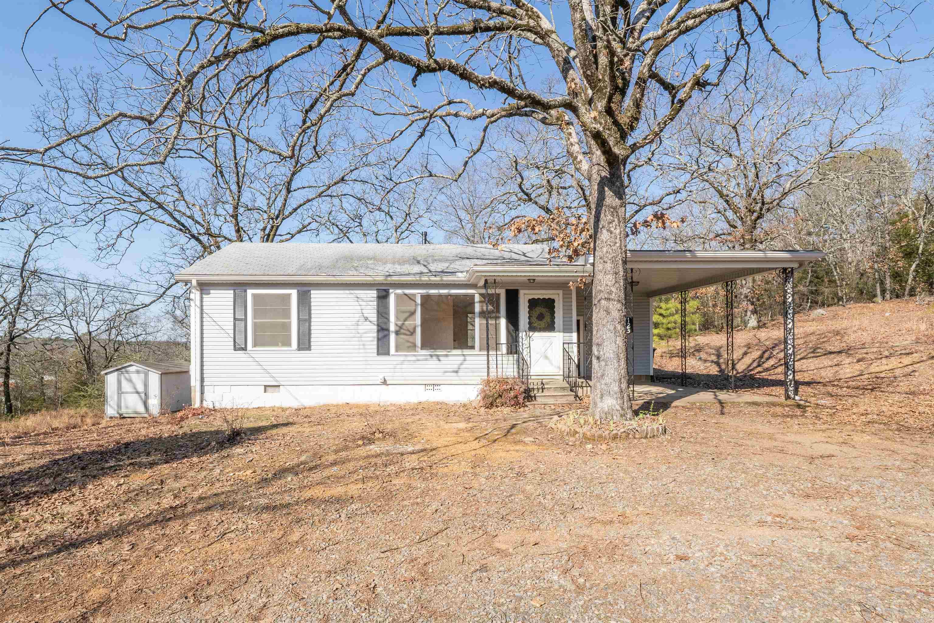 This charming home sits on .85 acres with an additional .55 acre lot for a total of 1.4 acres, offering plenty of room for outdoor activities and future expansion. The wood floors have all been refinished. The galley style kitchen has all new appliances making it both stylish and functional. The bath has new sink, toilet and vanities adding a modern touch. Two additional outbuildings for additional storage plus a new septic. Whether you're looking for a peaceful retreat or a home with room to grow this property offer the perfects blend of comfort and practicality.