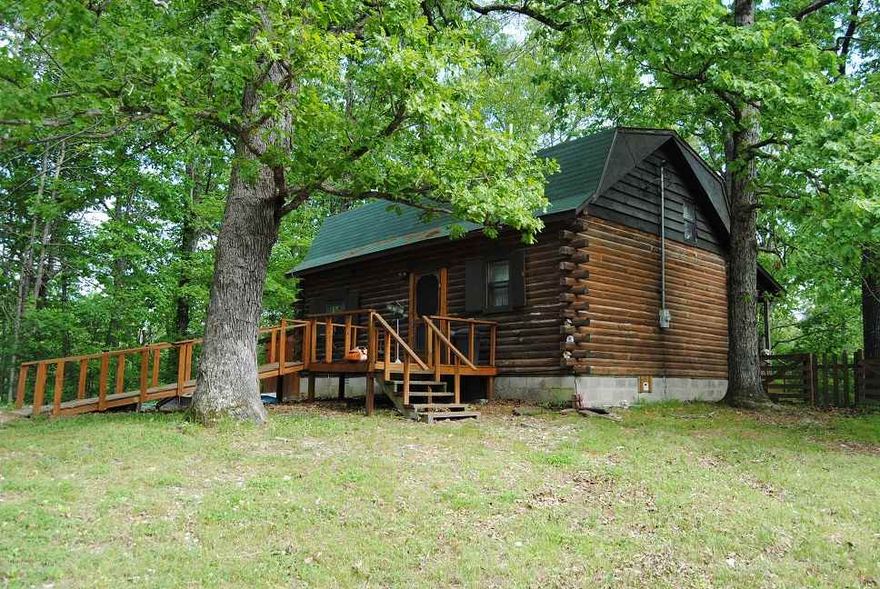 THIS IS AN LOG HOME, WITH 2 BEDROOMS UP STAIRS,  TRUE LOG HOME , WITH A LAUNDRY ROOM, PANTRY , NICE BIG FRONT COVERED FRONT PORCH A DECK OUT BACK, STORAGE BUILDING, HAS A GUEST HOUSE 700 FT UP HILL WITH WATER AND ELECTRIC, VERY PRIVATE, NICE WOODS, LOTS OF WILDLIFE, DEER, TURKEY, BEAR, ALL SORTS OF CRITTERS, HOME IS IN A VERY PRIVATE SETTING, SITS UP A GENTLE SLOOP 320" OFF A REALLY GOOD COUNTY ROAD, VERY WELL MAINTAIN, BLOCK FOUNTAIN, HAS APPLIANCES TO CONVEY, THIS IS PRICED TO SELL, NEED TO CALL SOON
