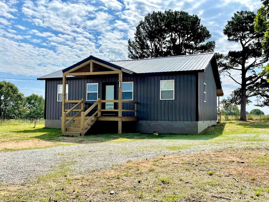 COUNTRY LIVING with a manageable property! This NEW HOME features 2 bedrooms & 2 full bathrooms. The spacious living/kitchen area has vaulted ceilings, beautiful cabinets, stainless appliances, and an island.  The master suite has a large walk in closet and spacious bathroom with walk in shower.  The home is wheel chair accessible and has a large back deck with great views of a neighboring farm. The yard offers large shade trees as well as an apple tree!  There is a 24x20 shop with concrete floors!  Located only 10 minutes outside of Melbourne!