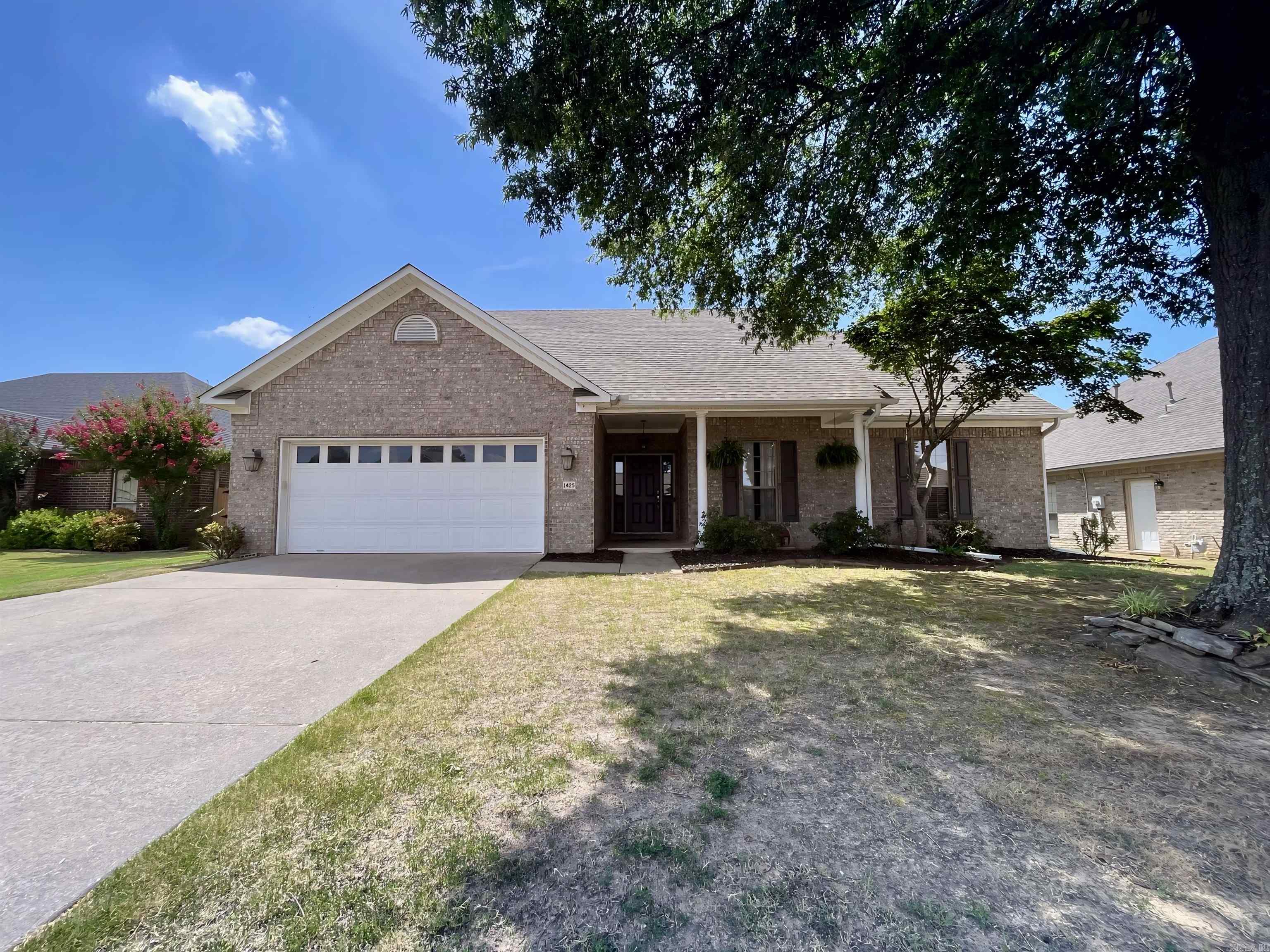 Gorgeous 3 bed, 2 bath home in the desirable Southwind Subdivision! This move-in ready gem offers fresh neutral paint, stylish updated light fixtures, and a contemporary, inviting feel throughout. Step into a spacious open-concept layout with high ceilings, hardwood floors in the living and dining areas, tile in the kitchen, laundry, and baths, and plush carpeted bedrooms. The kitchen features clean white cabinetry, stainless steel appliances, food pantry, and a large appliance pantry in the laundry room. Cozy up by the gas fireplace or entertain with ease on the oversized covered back patio complete with ceiling fans for those warm summer afternoons. The privacy-fenced backyard offers tons of space, plus an additional detached storage garageāperfect for lawn equipment. Recent updates include a new roof and water heater (under 3 years old), and HVAC was replaced in 2016. With a two-car attached garage and beautiful curb appeal, this home truly has it all!