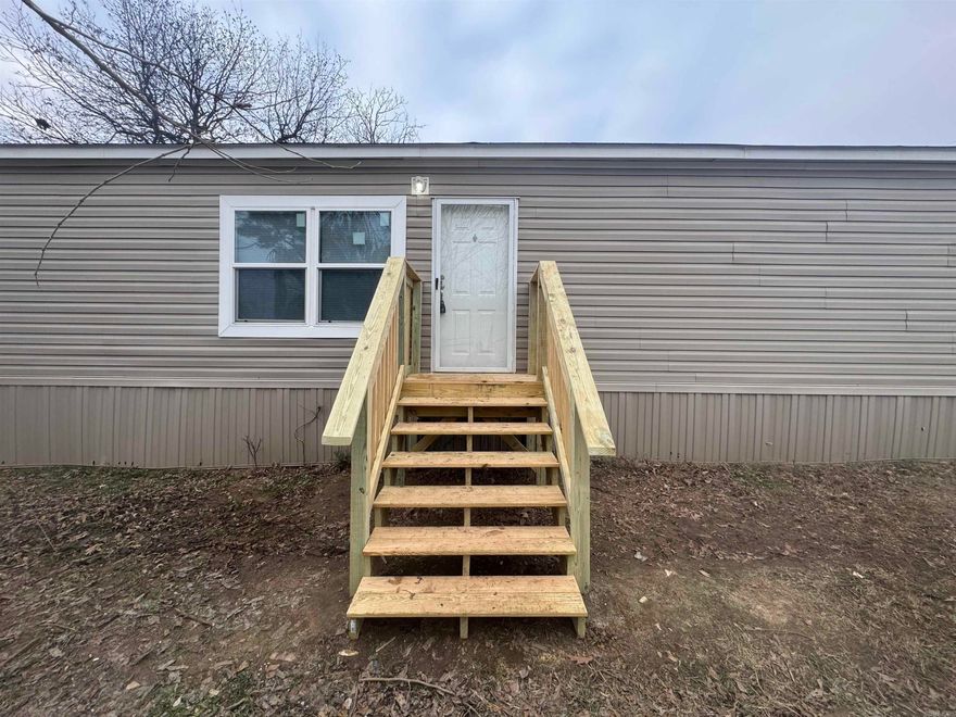 This is a beautifully remodeled single-wide mobile home on permanent foundation, built in 2021, and offers 1216 square feet of comfortable living space. Equipped with appliances for that first time buyer. Featuring three bedrooms, two full baths, this home is situated on a .16 of a lot conveniently located within city limits, providing both convenience and tranquility. Just 28 minutes from the University of Jonesboro of Arkansas.  Ask your agent about Seller Financing available!