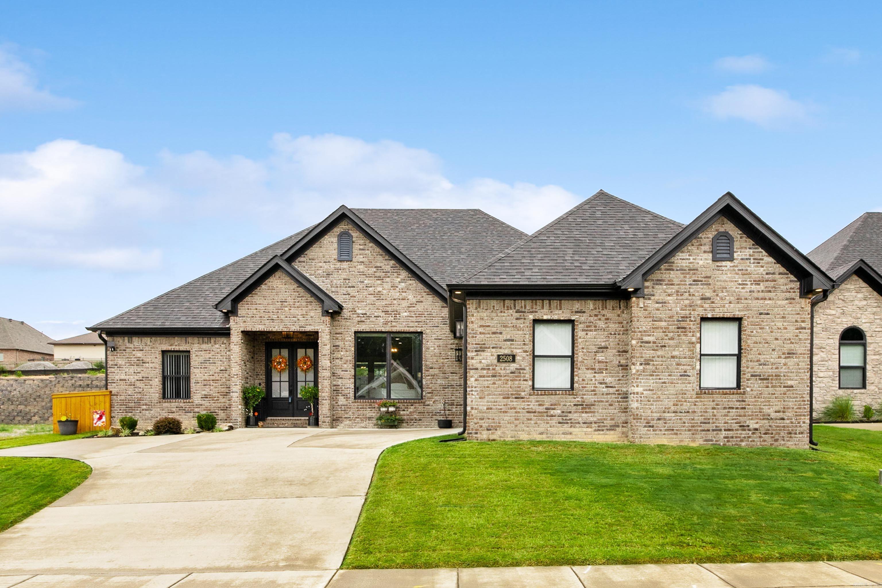 Beautiful custom-built home in gated Hurricane Gardens, less than 3 years old and loaded with upgrades! This open-concept design features a spacious kitchen with a huge breakfast bar, gas range, and refrigerator that stays, all overlooking a living room with 12-foot ceilings and a gas fireplace. The private primary suite offers a feature wall, vaulted ceiling, custom tile shower, and a walk-in closet that doubles as a FEMA-approved safe room. Enjoy wood-look ceramic tile floors throughout, a large laundry/mudroom with butler’s pantry, and a $15,000 whole-home generator. Outdoors is where this home truly shines — a covered patio with cathedral ceiling and granite outdoor kitchen, plus an incredible heated and cooled, site-built shop that’s perfect for hobbies, storage, or extra workspace year-round! All bedrooms and closets are generously sized—close to everything yet tucked inside a peaceful gated community!