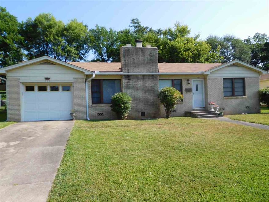 A WELL MAINTAINED 3BR 1.5BA city home!  Conscientious sellers have lovingly cared for this home and updates include:  extra insulation, newer roof, storm doors & gutters, new tile flooring in kitchen with french doors leading to a covered patio and lush level yard!  This house offers a great floor plan, large & open living-dining areas w/fireplace, and appliances are included.  Exterior is brick w/vinyl trim, there is a single car garage w/remote opener + 10x12 Bigelow storage bldg.