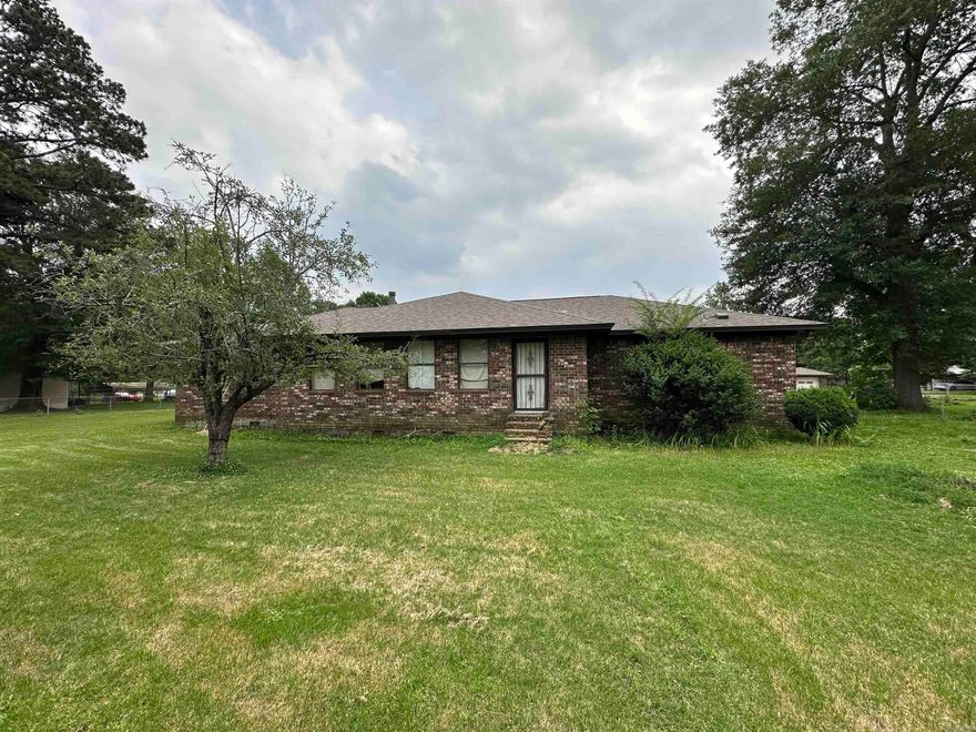 Discover comfort and space in this expansive 5,007+/- sq ft ranch home, situated on a generous 1.06+/- acre lot in the heart of Des Arc, AR. Built in 1977, this all-brick home and small acreage offers 3 living areas, 4 spacious bedrooms, 3 full bathrooms, and 2 half bathrooms, making it perfect for those needing plenty of living space. The home and acreage are listed for sale below the recently appraised value. The home features 3 living areas, ceiling fans throughout, and energy-efficient insulated windows and doors that enhance comfort and reduce utility costs. The attached 2-car garage and additional detached garage/shop provide ample parking and storage space. Enjoy the outdoors year-round with an enclosed screened porch, ideal for relaxing with a morning coffee or evening breeze. Just steps away lies an in-ground swimming pool, ready to become your backyard retreat—once a new liner is installed. It may be the perfect setting for summer fun and gatherings. This unique property offers endless potential with a solid structure, newer roof, spacious layout, and outdoor features that make it truly special. Don’t miss the opportunity to own a slice of peace and privacy.
