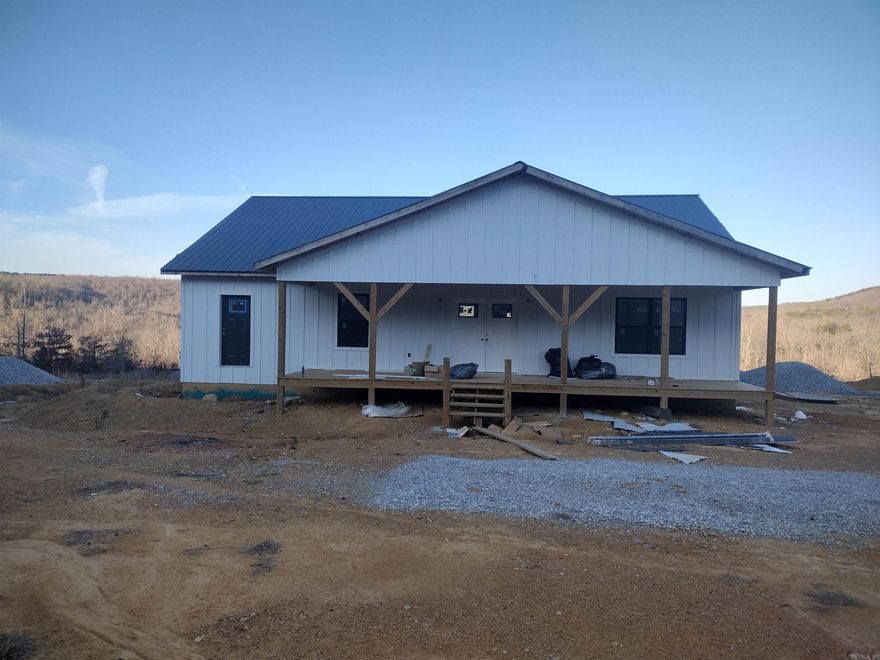 Looking for views with privacy check out this home New unfinished home this home is wired plumbed has sheet rock installed and come with almost all material to finish comes with new Frigidaire appliances. Double gas range, drawer microwave full size refrigerator and separate full freezer on side, dishwasher, tankless water heater and Cali flooring 50-year warranty. This is a must-see property with lots of potential they are still currently working on this home.