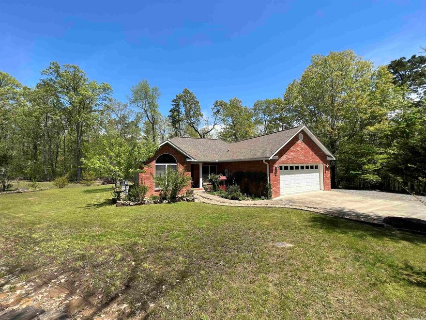 Welcome to the market this 3 bd 2 bth home w no restrictions on over 4 acres! This well maintained home offers double closets in the master bedrooms, Koehler fixtures, kitchen aid appliances, under ground propane tanks, low mainteance land scaping, new & synthetic deck, Pella Windows, Marathon Water Heater, levolor blinds,  concrete driveway, extra carport storage shed, sets surrounded by woods with no neighbors in the eye sight & a boat ramp less than 2 miles away and Walmart under 10 mins & fiber internet