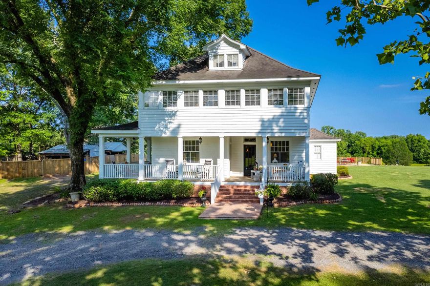 Step into a piece of history with this beautifully maintained country estate, originally built by a doctor in the early 1900s. Nestled on approximately 12.64 acres of serene countryside, this stately plantation-style home seamlessly blends classic elegance with modern functionality.Boasting 5 spacious bedrooms and 4.5 bathrooms, the home offers three zoned stories of well-appointed living space—ideal for multigenerational living or hosting guests. Enjoy the sweeping views from the iconic wrap-around porch, perfect for morning coffee or sunset gatherings.Outdoors, relax by the picturesque pond with a dock, or entertain from the expansive deck that conceals a storm shelter for peace of mind. Rich in heritage and character, this property invites you to experience Southern living at its finest, with space, comfort, and history wrapped into one extraordinary offering.**Agents See Remarks**