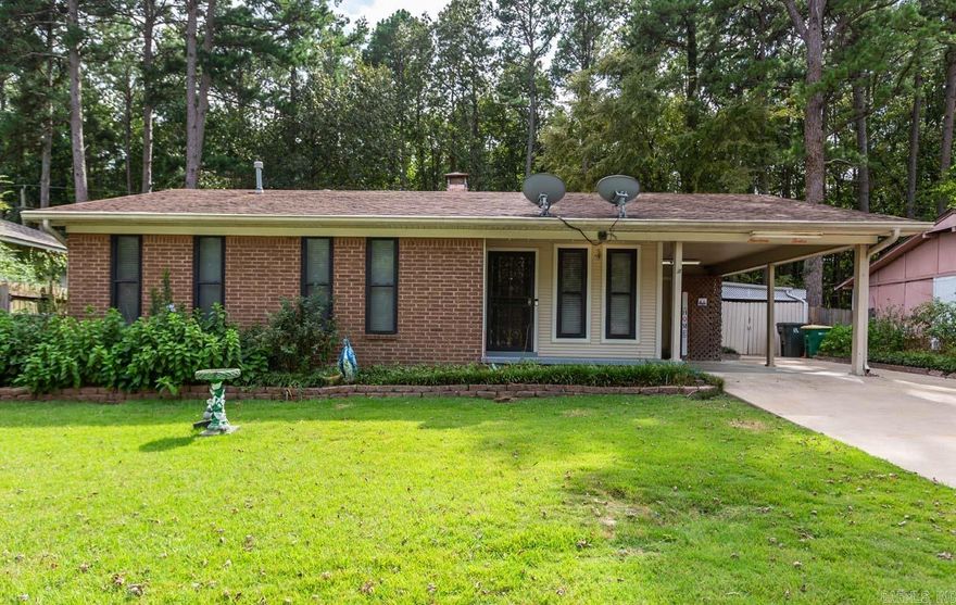 Great one level, 4 bedrooms, 2 1/2 baths with fireplace in a quiet neighboorhood. Two living areas, living room and family room. Dining area with bay window and tile flooring. Nice size kitchen with plenty of counter space. Large patio with storage area in the fully fenced backyard. Workshop by the carport. Newer Generac Generator with auto-transfer switch 11/21. Architectual roof approximately 10 yrs old. Close to freeway, restuarants and hospital in West Little Rock. Home to be "SOLD AS IS."