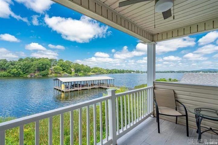 Spacious 4-Bedroom, 2-Bath Blue Heron Condo – Serene Lakeside Retreat Nestled in a tranquil and private setting, this beautifully appointed 4-bedroom, 2-bath condo in the desirable Blue Heron complex offers the perfect blend of comfort and convenience. Enjoy stunning lake views while relaxing by the pool in this peaceful community. Currently operating as a successful Airbnb, this property can continue as a turnkey short-term rental if desired. Located just minutes from Oaklawn Racing & Casino, premier shopping, top medical facilities, and a variety of dining options. You can even take your boat to nearby lakeside restaurants for a unique dining experience!