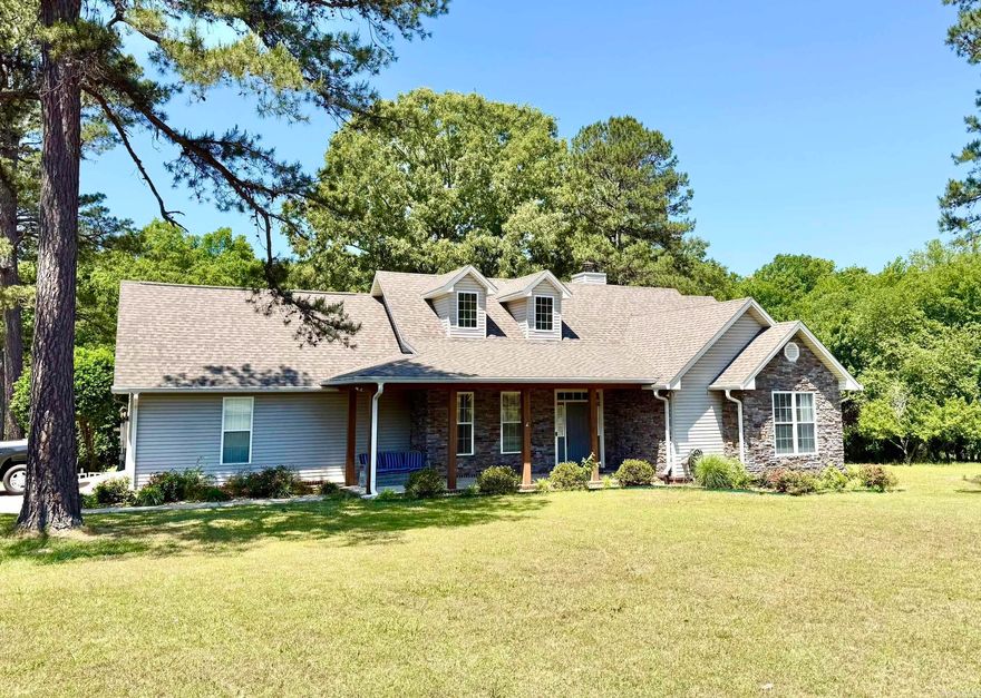 Situated on 1.25 acres in a quiet setting, this well-maintained home offers space, functionality, and recent updates throughout. Featuring 3 bedrooms, 2.5 bathrooms, and an additional 551 sq ft heated and cooled bonus room upstairs making it a true 4 bedroom house, the home provides approximately 2,550 sq ft of total living space.  The property includes a 2-car garage with an in-floor storm shelter, a long driveway with ample parking, and a newly built wood deck—perfect for enjoying the outdoor space.  Recent updates include a NEW ROOF (2023, NEW HVAC system (2022), NEW Dishwasher (2026), Washing machine (2024), and kitchen appliances including refrigerator, microwave, and range (approx. 2022). A new water heater will be installed prior to closing and is designed to support simultaneous multi-shower use.  Additional features include a bonus refrigerator in the garage and a whole-home generator that conveys with the property.  Plenty of room to spread out—inside and out—while still enjoying the comfort of a move-in ready home.