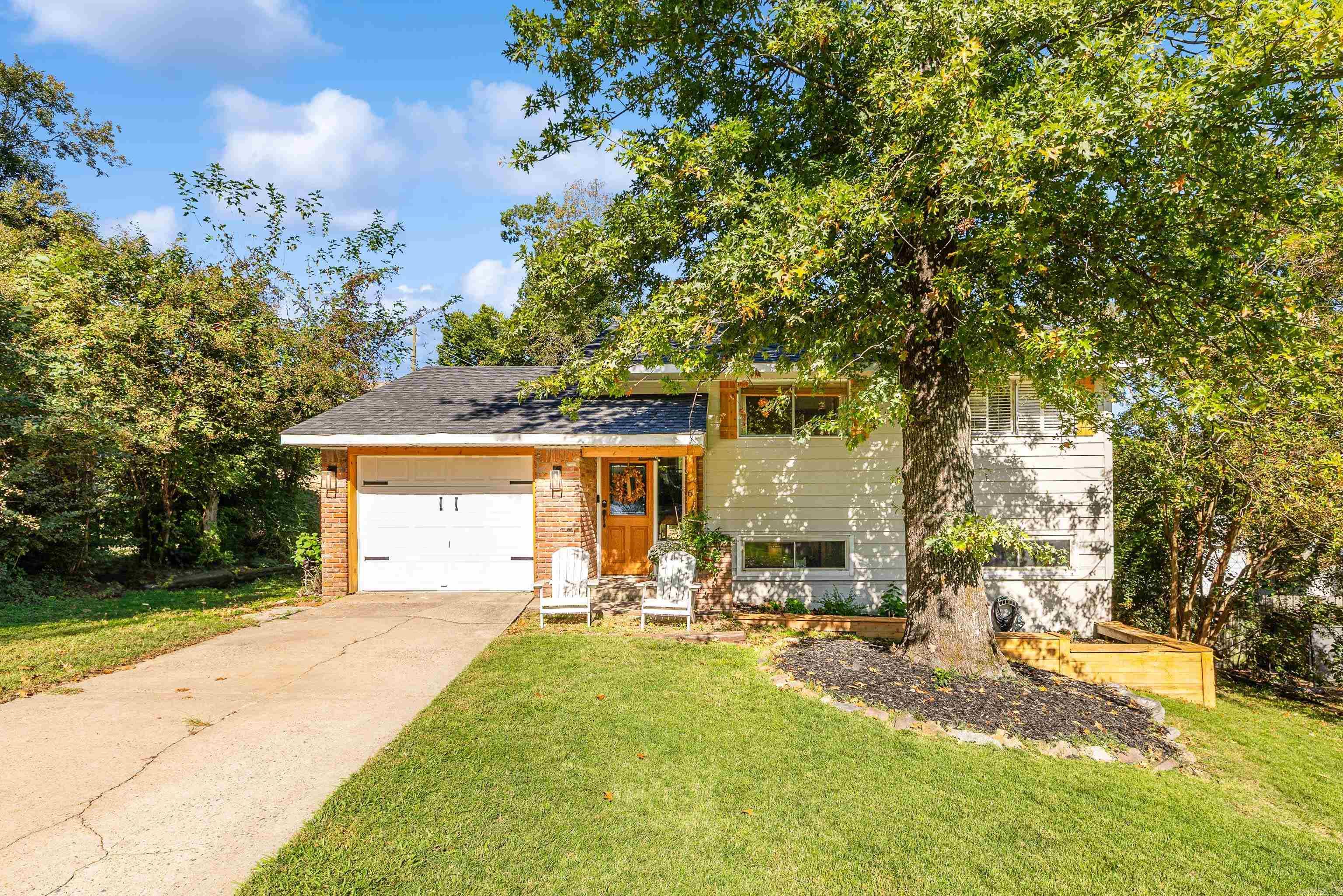An absolute GEM in Wilton Heights! This charming 3 bed/1.5 bath split level home has been well updated! Great entertaining space on the lower level. Kitchen has great natural light, butcher block countertops, a built-wine wine chiller and new backsplash. The open layout flows to the freshly painted family room where you can visit at the fireplace or take the gathering out onto the newer, tiered deck and oversized backyard with new privacy fence. Retreat upstairs at the end of the day to the living room and three bedrooms (one currently used as a home office). Just a minute or two from restaurants and shopping. This fantastic home apparised for much higher! Don't miss it!