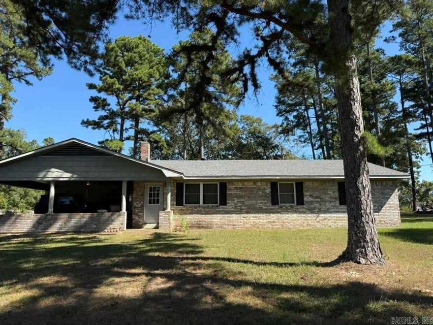 LISTEN TO THE PINES outside this well-built and well-maintained 3 bedroom, 2 bath ranch home on 2.55 acres! This home is located on the ridge near Bethesda Springs just minutes from WOLF PEN GAP TRAILS and Mena.  The large carport is perfect for outdoor entertaining and has a room that can be used for guests as well.  Updates include new doors, new roof, and a new wood stove. Amenities include a breakfast bar, dishwasher, microwave, stove, disposal, washer, dryer, and a Stainless Steel refrigerator with ice maker.  In the primary bedroom the Bathroom has been recently updated with a beautiful tile shower for easy access and second bath has a nearly new walk-in-tub!  There is a 24x30 detached garage in back, and this home has both city water and a well.  The possibilities are endless. Hurry, hurry, this one will go fast!