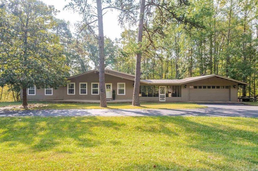 Welcome to your new home in Diamondhead! This beautifully remodeled 3-bedroom residence boasts a versatile bonus room that can serve as an additional bedroom or home office. With 3 modern bathrooms, a spacious .85-acre lot, and 2,414 square feet of living space, this property offers both comfort and versatility. This home features a recent renovation, including new flooring throughout, a modern kitchen with new appliances, new granite countertops, and new cabinets. This home boasts a screened-in porch for outdoor relaxation and a cozy living room with a fireplace. The master suite is an indulgent retreat, featuring an expansive bedroom, an oversized walk-in closet, and a luxurious ensuite bathroom creating a spa-like experience. Movie nights are a delight with the included projector, and a two-car garage adds extra storage with the shop area. Priced at $289,900, this home presents an exceptional opportunity to enjoy a blend of contemporary living and natural beauty in the secure, gated community. Don't forget to also check out the swimming pool, golf course, clubhouse, basketball courts, tennis courts, and even two restaurants for you to enjoy!!