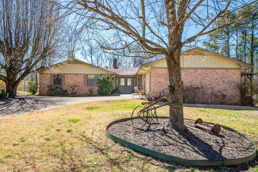 This well maintained spacious brick home has everything you are looking for... Delightful neighborhood, convenient to Lakeside Schools with end of cul-de-sac location, separate extra workshop /garage in addition to the two car garage, storm/ tornado shelter, lovely landscaping, cheerful sunroom, large kitchen with breakfast area, plenty of storage, formal dining area, fireplace, hardwoods, built-ins, laundry room, entry foyer with leaded glass doors, and so much more.  The roof is newer and the private outdoor areas are lovely with many thoughtfully added features including a covered deck overlooking the large backyard.