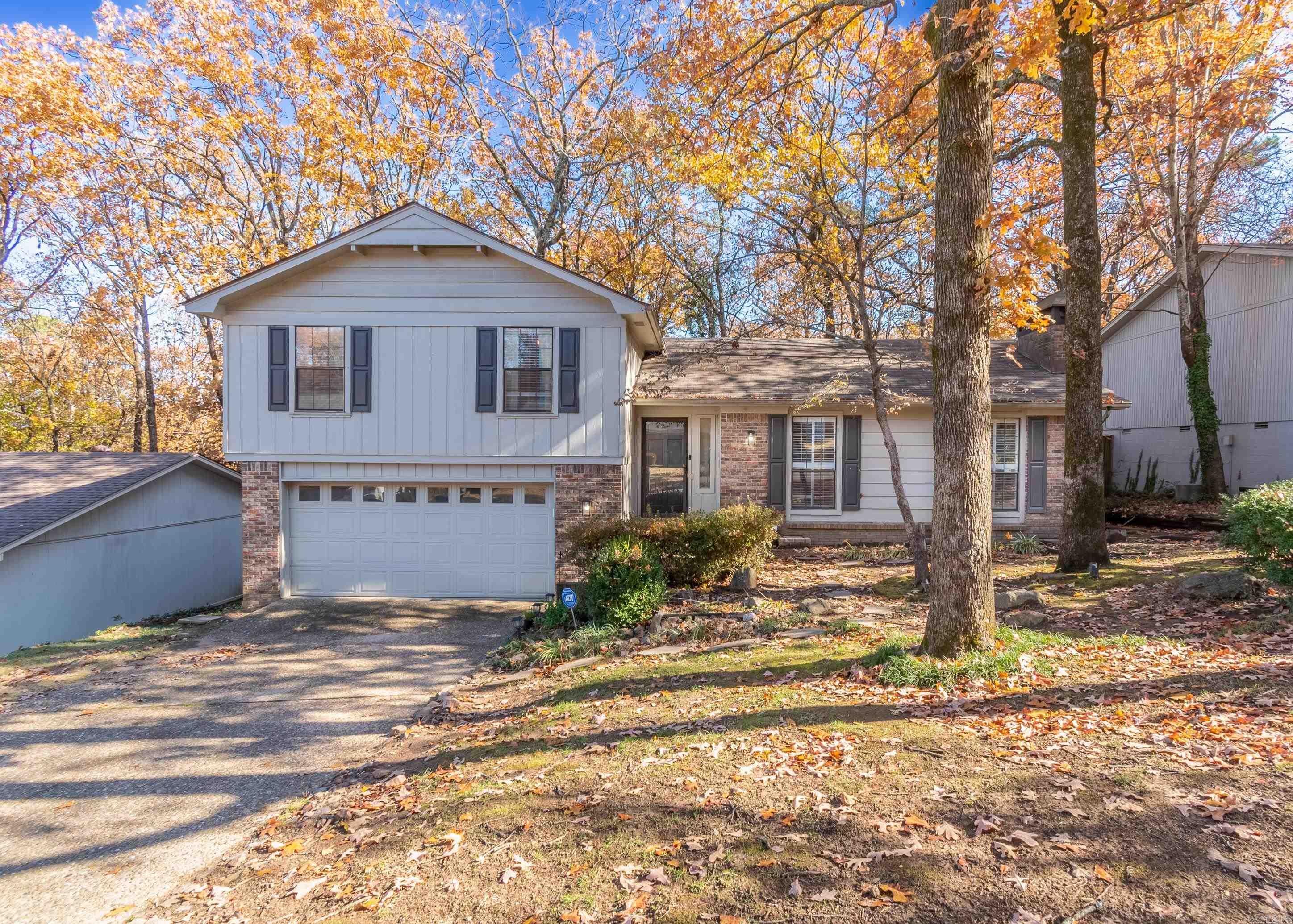 MOVE-IN READY HOME IN WEST LITTLE ROCK! Nestled at the end of a quiet cul-de-sac, this inviting home has space for everyone. The main level features a large living room with built-ins and a cozy gas fireplace and a bright kitchen with breakfast area and bay window that opens to the formal dining room, making this space perfect for entertaining. A versatile fourth bedroom with a half bath is on lower levelāgreat for a guest room, office, or hobby space. Upstairs are the primary bedroom with ensuite bathroom and double closets, and 2 additional guest rooms. Step outside to a multi-level deck with natural gas hookups and outlets for lighting and music, overlooking a fully fenced and wooded backyard with a playset and brick patio. Perfect location, close to all of the amenities of West Little Rock, but still with a private and wooded feel & a new roof in 2023!!!!
