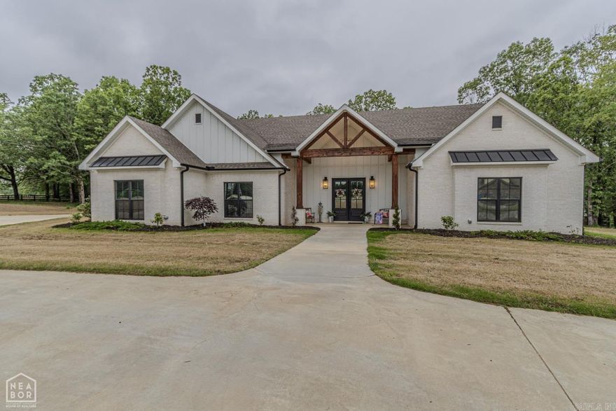 Welcome to your dream home in the sought-after Lakes at Pineknot! This 4,900 sq ft home blends timeless design with modern luxury on a private 4.09-acre lot. It features 4 bedrooms (plus optional 5th bonus room), 3.5 baths, and a flexible floor plan perfect for daily living or entertaining. The show-stopping kitchen includes double islands, high-end appliances, and a hidden walk-in pantry. The spacious living area opens to a covered patio with built-in electric heaters for year-round comfort. The large bonus room can serve as a 5th bedroom, theater, playroom, or guest suite, and a dedicated office adds convenience. The luxurious primary suite offers a soaking tub, dual vanities, and an oversized walk-in closet with a center island. Additional highlights: oversized 3-car garage, safe room, ample storage, large laundry, and private lake access. Don’t miss this one—call today to schedule your showing!