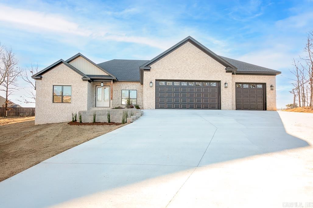 Beautiful new construction in Greystone!  This home offers a 3 car garage, 2350 sq ft with 4 bedrooms, 2.5 baths. Walk in the double front doors & formal dining area is to the right, large living room w/gas fireplace accented w/stone, kitchen has lots of cabinets that reach the ceiling, gorgeous quartzite countertops & backsplash, gas stove, pantry, island, under cabinet accent lighting. Large laundry room, pretty half bath for your guests. Two bedrooms on the left side and 2 bedrooms on the right.  Master suite is spacious with a spa like bathroom.  It has a walk-in shower, soaking tub, make-up vanity, double sinks and under cabinet accent lighting & huge closet.  Wood laminate flooring and tile throughout, no carpet.  Beautiful light fixtures.  Covered patio with extra pad, tankless water heater.  Huge backyard and plenty of parking space! Walk up attic stairs! Almost completed!!