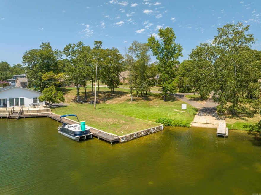 LEVEL lot with LAKE VIEWS of Lake Hamilton & 7 South Central bridge! Build your dream lake home as close as you can get to the water without the cost of being lake front. Enjoy deeded lake access right next to your property in this quiet, well maintained neighborhood located just outside of the city limits with no POA dues. City building permits are completed, so bring your house plans and start construction immediately! Bill of assurance and current survey to be provided. Homes must be 2400 sq ft minimum.
