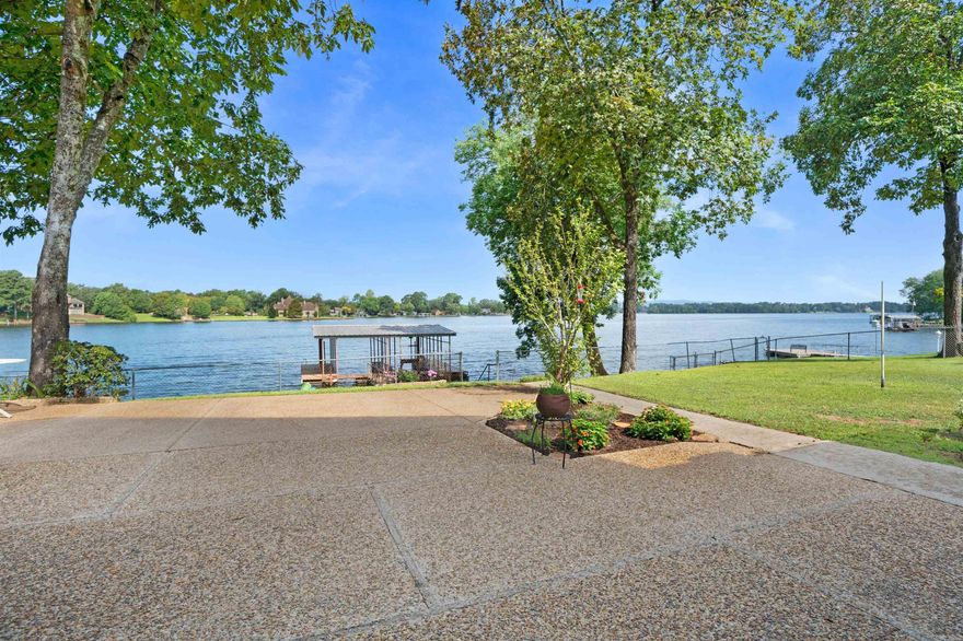 Hwy 7 South Area, Prime Lakefront, and Lakeside School District! Tucked on a side street in the sought after Caroline Acres Addition, your next adventure awaits. Not all lake lots are created equal and this one is the main attraction, and the VIEWS...from gorgeous sunsets behind Jack Mountain to sweeping open water down the main channel - it feels like you're on a peninsula . A double boat dock in year round water is ready for your watercraft and the simple, yet ample home is an excellent blank canvas ready for your re-imagining. A remodel 10 years ago brought it into the 21st century (see *updates below) OR do a tear down and build your dream home! This lot is that rare. Kept within the same family since 1977. (*updates: electrical, plumbing, HVAC, windows, tankless hwh, new kitchen with granite, custom alder cabinets, custom red oak cabinets in baths, new sheetrock & insulation, roof and flooring, etc. There was also addition of a new 2nd story with den, two huge bedrooms each with their own baths, walk-out storage in attic, and primary bedroom overlooking the lake with lots of windows and cantilevered deck.) (empty rooms virtually staged)
