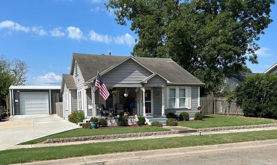 Home with an accessory dwelling w/shop. There are so many possibilities this property has to offer. Located right in the heart of Dardanelle on historic Front Street, you could live in the home and enjoy the shop with living quarters or use as a rental income or as an Air B&B or business as it is zoned commercial. The accessory unit w/shop was built in 2020. HVAC was installed in 2021. It is fully insulated with 24x50 under roof.!0x24 is open patio with a beautiful outdoor limestone fireplace and plumbed for an outdoor kitchen sink,10X24 living area has vaulted ceiling loft bedroom, full bath with tiled walk in shower. 30x24 is open shop. Tankless water heater, roll up doors and car lift.