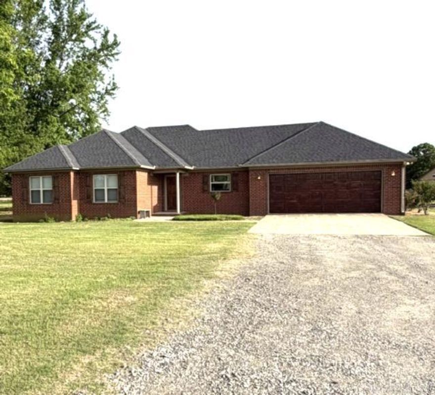 Seeking a rural residence situated on over 10 acres of land, complete with a stocked pond?  Look no further!  This beautiful, well-maintained brick 3/2 decorated home, featuring a spacious back porch is ideal for hosting gatherings. The inside stained concrete floors and fireplace is aesthetically pleasing.  The expansive acreage is fenced and cross-fenced, supporting multiple outbuildings.  The large concrete-floored barn equipped with a 1/2 bath, is perfect as a working barn or mechanic shop. Additionally, the property includes a tack barn with 2 horse stalls and additional space for a separate business The building with the double carport has a tool/garden shed and additional sq ft for a possible She Shed., A metal shed located at the rear of the property would be suitable for raising chickens. The property also has an inground storm shelter that will easily support 12 people?  Call today for a showing?  Agents see remarks.