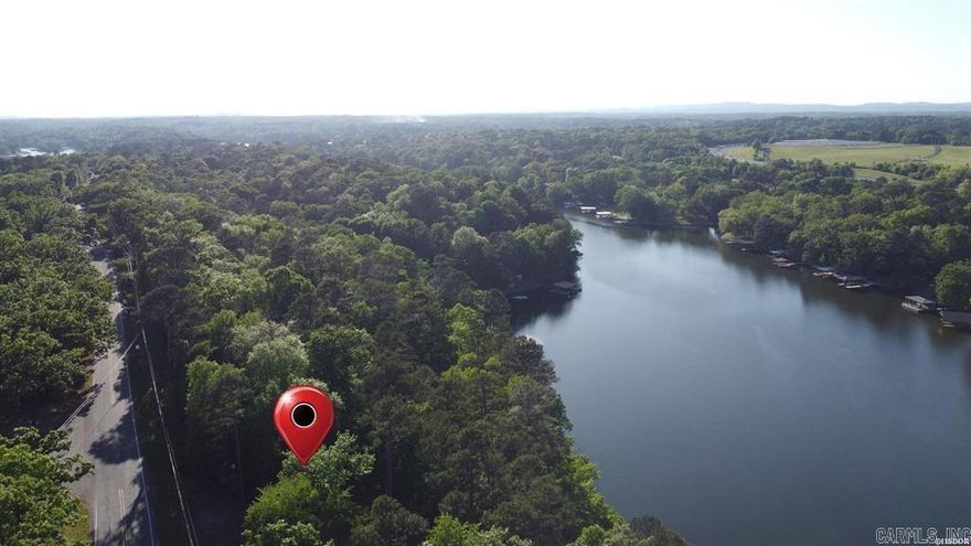 A rare find on Lake Hamilton, lakefront lots with buildable property and enough frontage to qualify for a 2 stall boat slip. Deep water and close to everything, this half acre lot can be purchased alone or with the adjacent lot for a negotiated price. Come see this space for your future home, lake living is calling your name. Shari Bales 501-418-1516