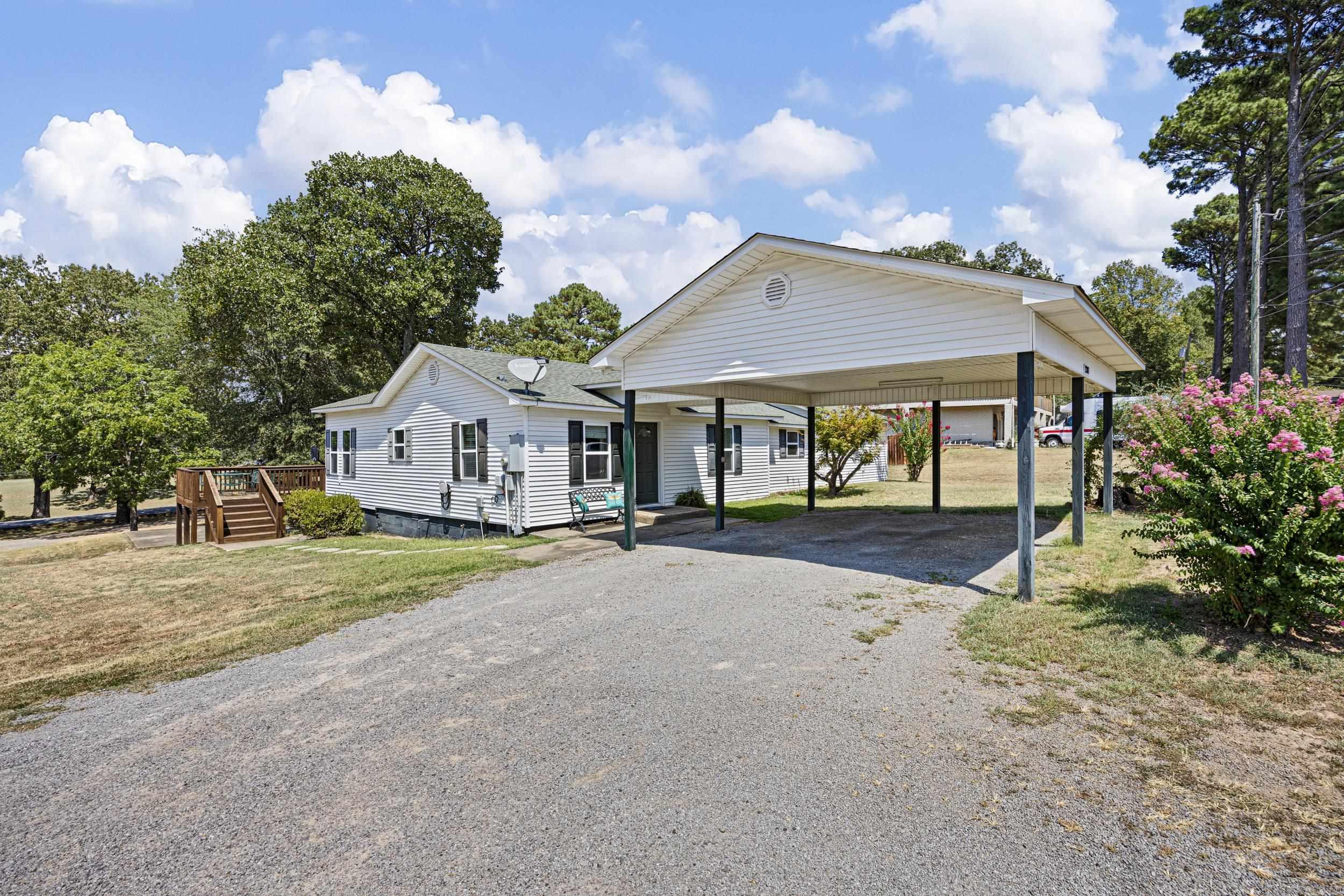 Beautifully updated 3-bedroom, 2.5-bath home in the heart of Morrilton! Featuring a remodeled kitchen with custom cabinets and countertops, a spacious den addition, and a custom deck, this home is designed for comfort and entertaining. Major upgrades include new windows, siding, insulation, and a 20x20 two-car carport (2014). Recent renovations bring modern style with granite bathroom countertops, vinyl flooring throughout, fresh trim and paint (2024), plus a brand-new gas water heater (2025). Features RV storage with a 30-amp plug and a shop with electricity. Move-in ready with timeless charm and thoughtful updates throughout!