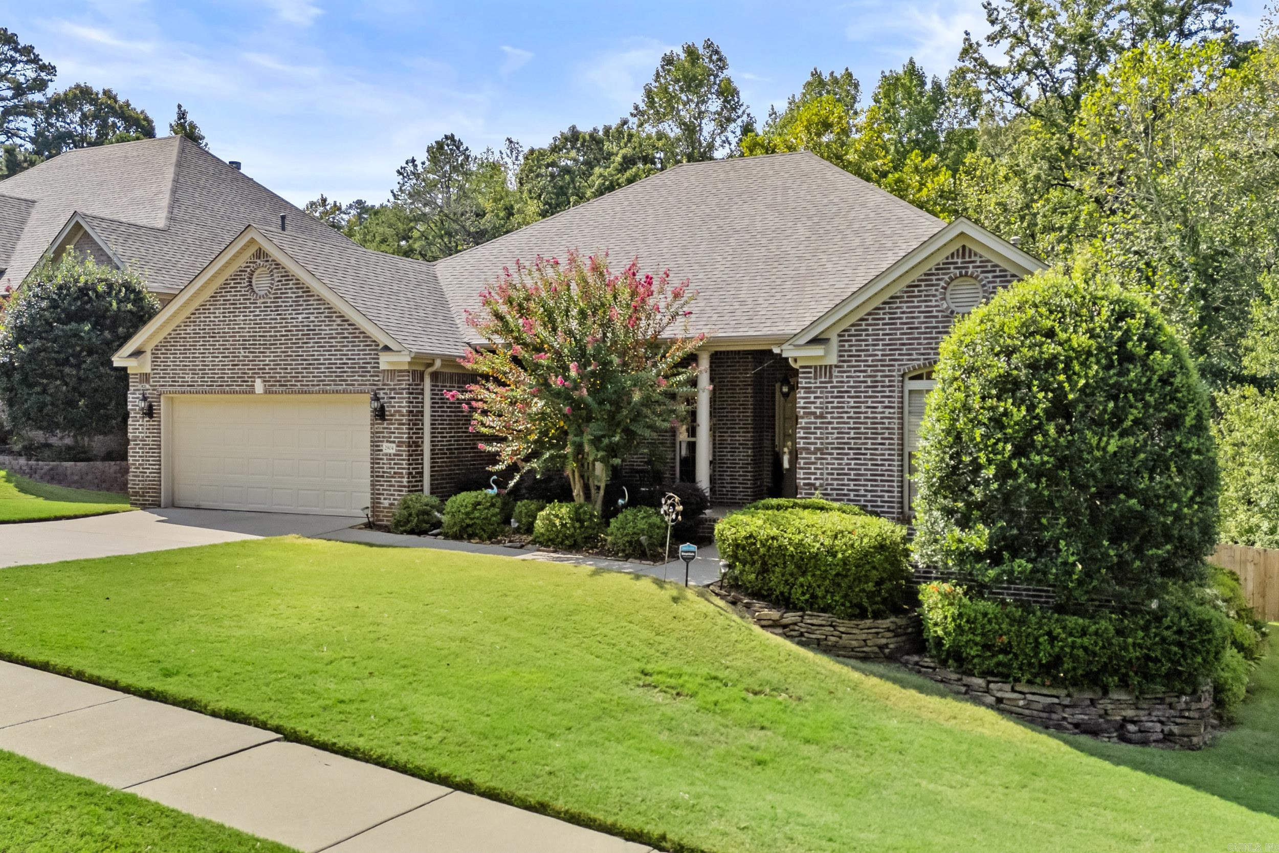 Immaculate one-story home on a quiet street featuring a charming front porch and a spacious back deck with serene views of greenspace and a hidden pond. This four-bedroom home offers a formal dining room, laundry room, and a bright eat-in kitchen. The generous living room with gas log fireplace creates the perfect gathering space. The master suite is thoughtfully separated from the guest bedrooms for added privacy. Recent upgrades make this home truly move-in ready, including a brand-new air conditioning unit (2025) and a new roof (2020)—giving you peace of mind for years to come. The neighborhood offers an active lifestyle with walking trails, playground, tennis courts, clubhouse, and a pool—all within walking distance. Zoned for the Baker Elementary School.